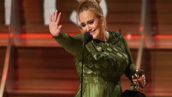 Adele shares a gentle laugh with friends, balancing lively energy with calm charm.