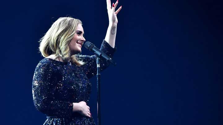 Adele calmly prepares before a show, managing inner tension with graceful composure