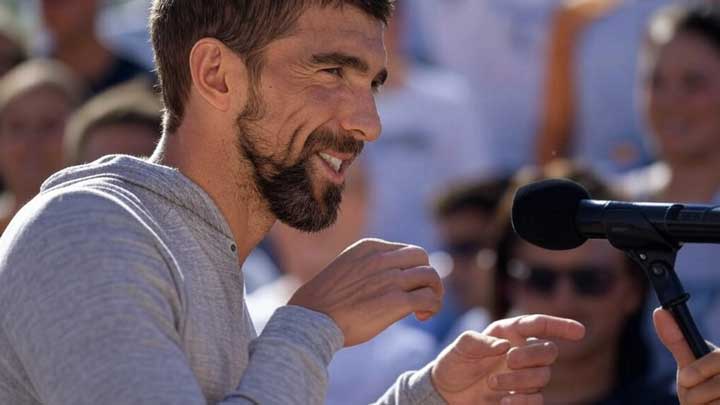 Michael Phelps speaks publicly with quiet confidence, reflecting measured social boldness and presence.