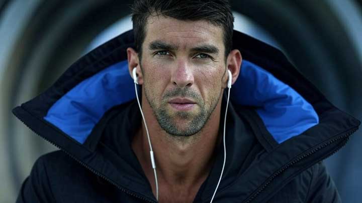 Phelps prepares for a race under pressure, radiating inner tension and pre-competition intensity.
